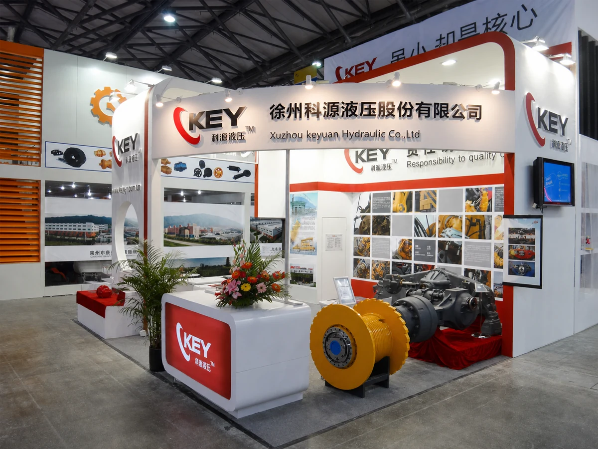 CKEY trade-show booth displaying hydraulic and drivetrain products